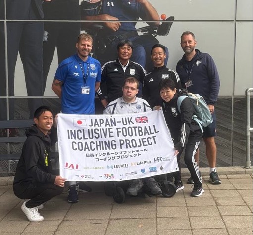 A group of students holding a flag