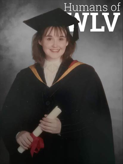 Debra Cureton in her graduation robes in front of a grey backdrop with white text reading Humans of WLV