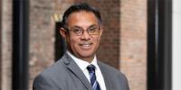 profile picture of Vice Chancellor Ebrahim Adia smiling