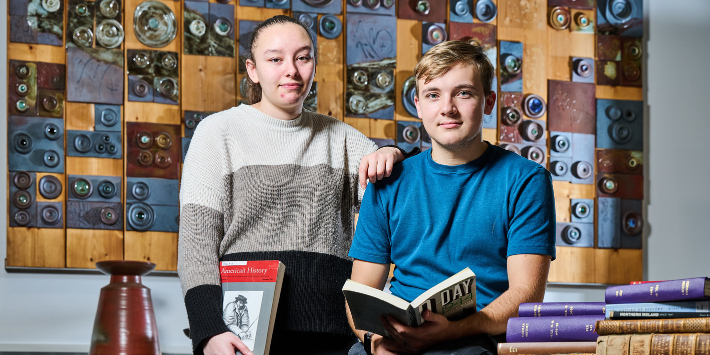 marketing shoot history students in library in front of artwork