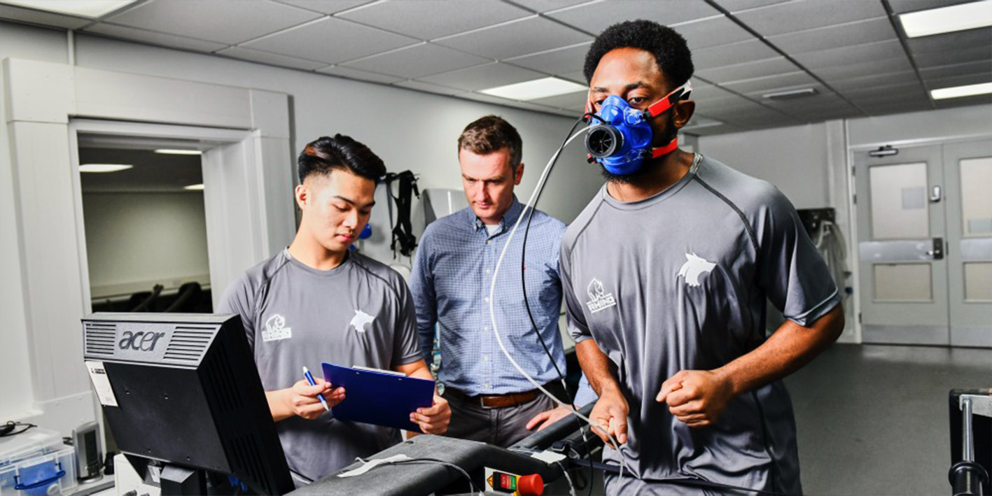 Sports students running fitness tests on a treadmill