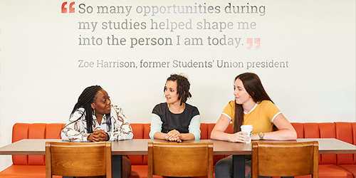 three students talking