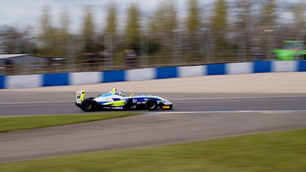 UWR Race Team car shot in motion at Donington Park in F3 Cup Championship.