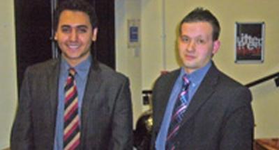 An image of two students who took part in a competition which tested their courtroom skills.