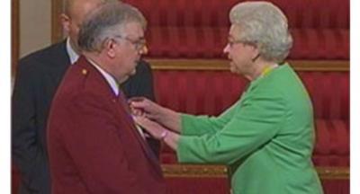 John Hay receives his MBE from the Queen