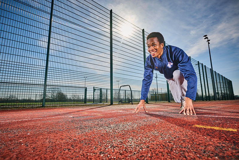 Image of a student preparing to run on the track at Walsall Campus.