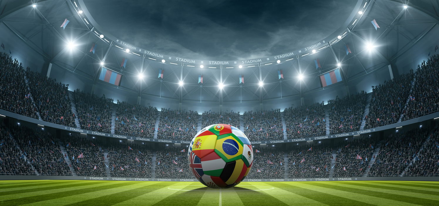AI generated image of a football stadium under spotlights. In the centre of the pitch is a football featuring icons from countries across the world.