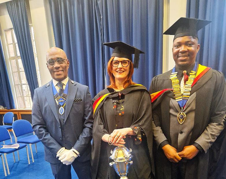 David Bourne, Security Team Leader and Mace Bearer for University ceremonial events, Marriane Pughe, designer and maker of the mace and Ikenna Okeke VP Diversity at the Student Union, showing off the Student Union medal that Marianne also designed.