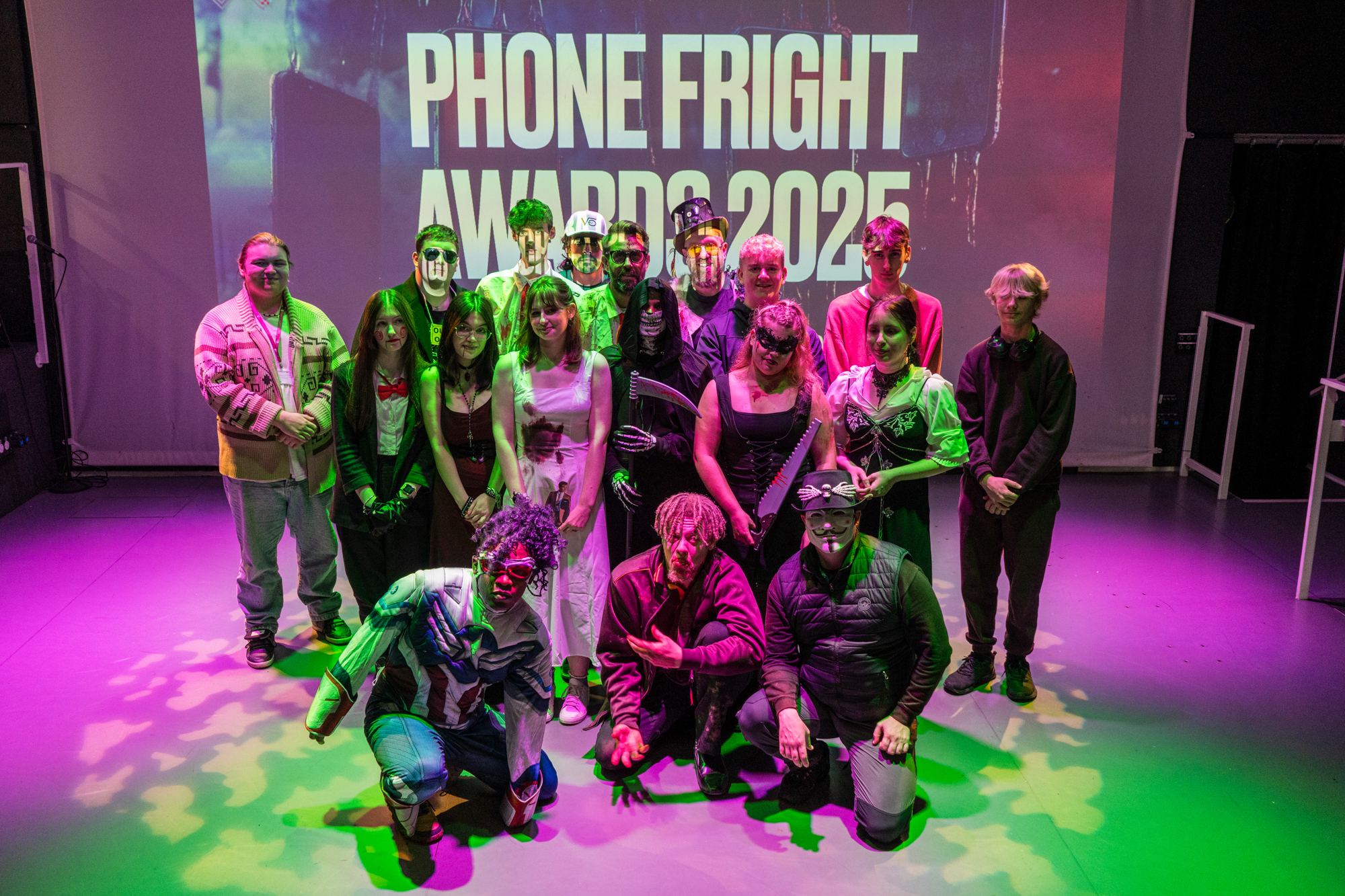 Students in Halloween fancy dress pose on stage at the FILM FRIGHT AWARDS 2025