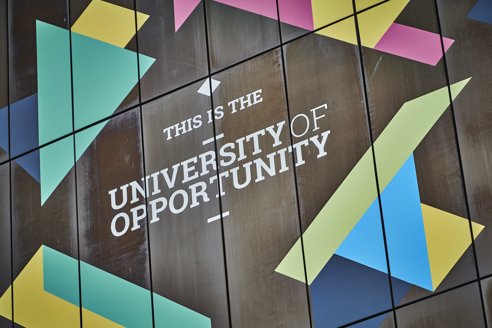 Picture of city campus with a mural saying 'City of Opportunity' and 'University of Wolverhampton'