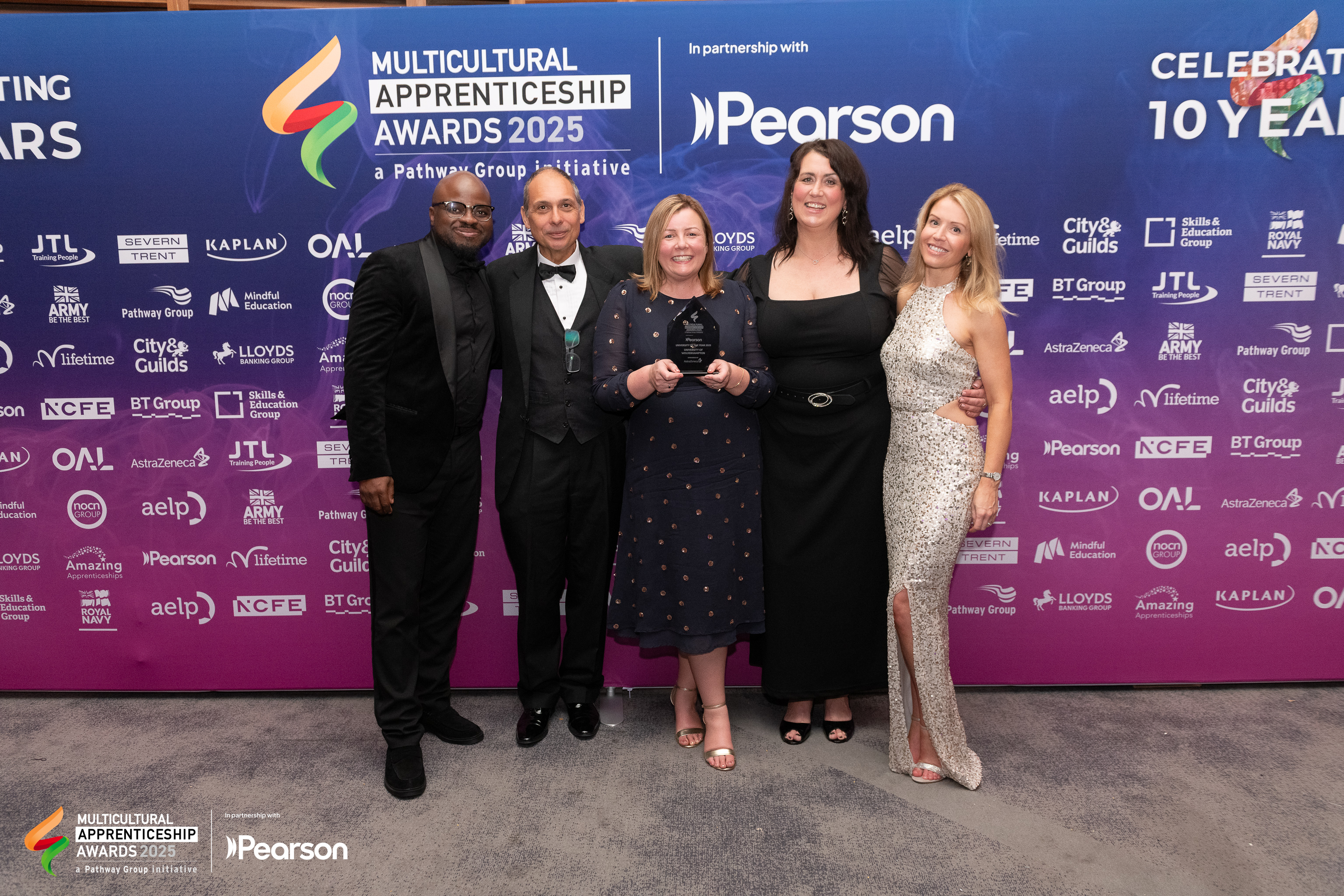Representatives from the University of Wolverhampton (left to right) Javin Dacosta, Dean Starr, Jenny Cannon, Helen Stott and Amy Allen collect their trophy at the Multicultural Apprenticeship Awards 2025