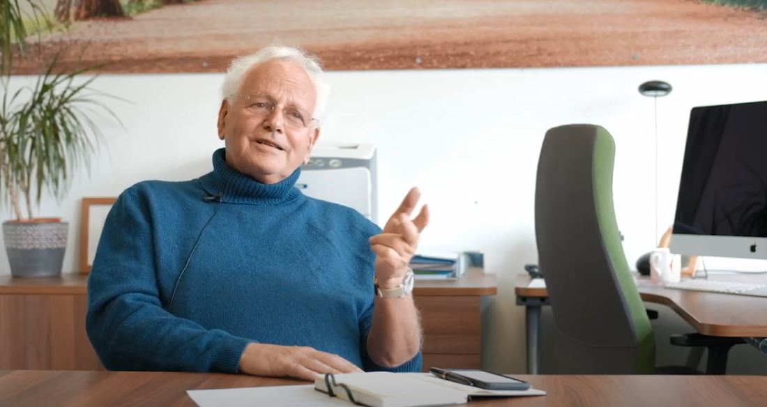 Header image of Sir Alan Tuckett in an office during an interview