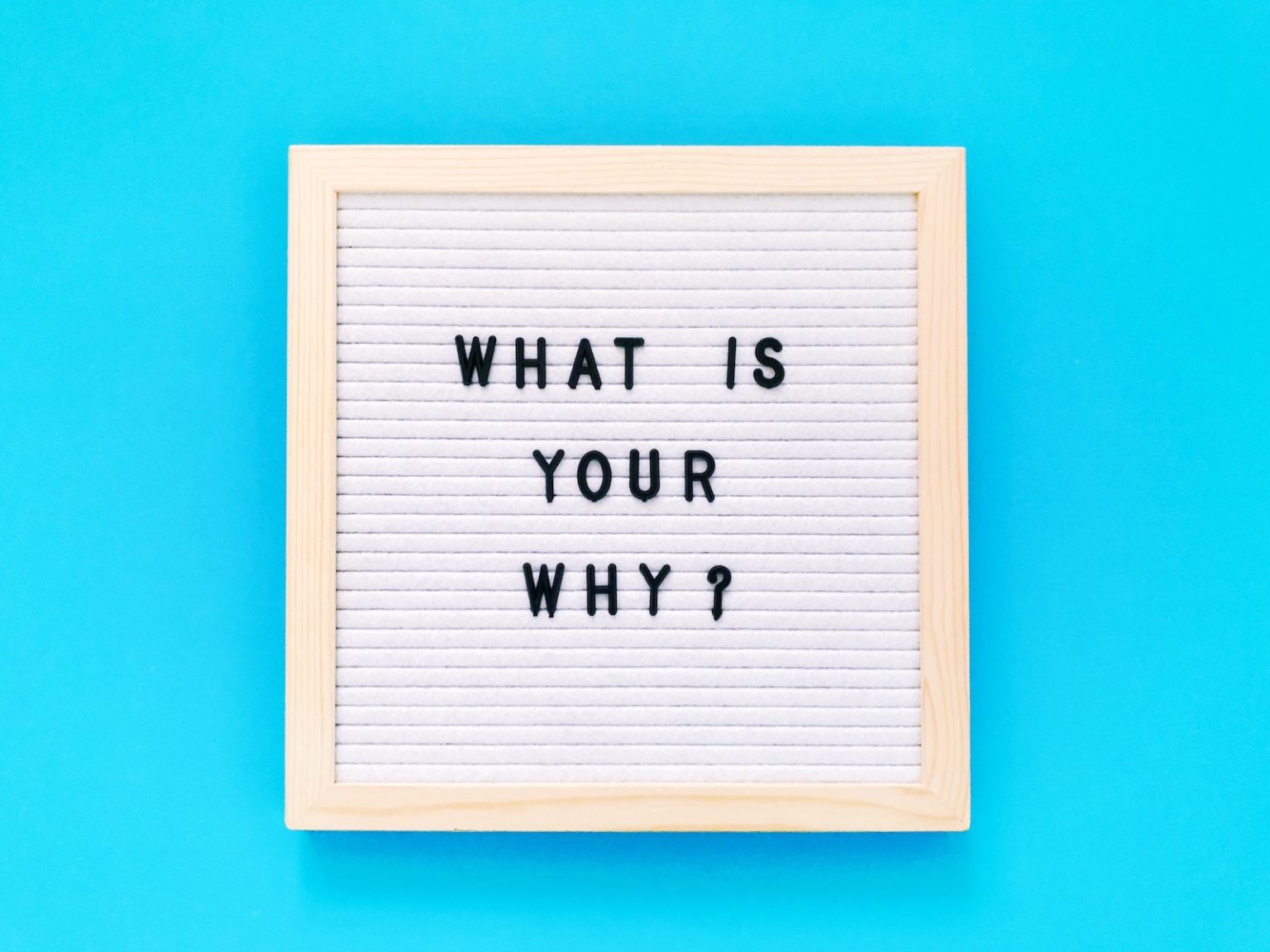 Header image of a framed board with the text What Is Your Why written on it