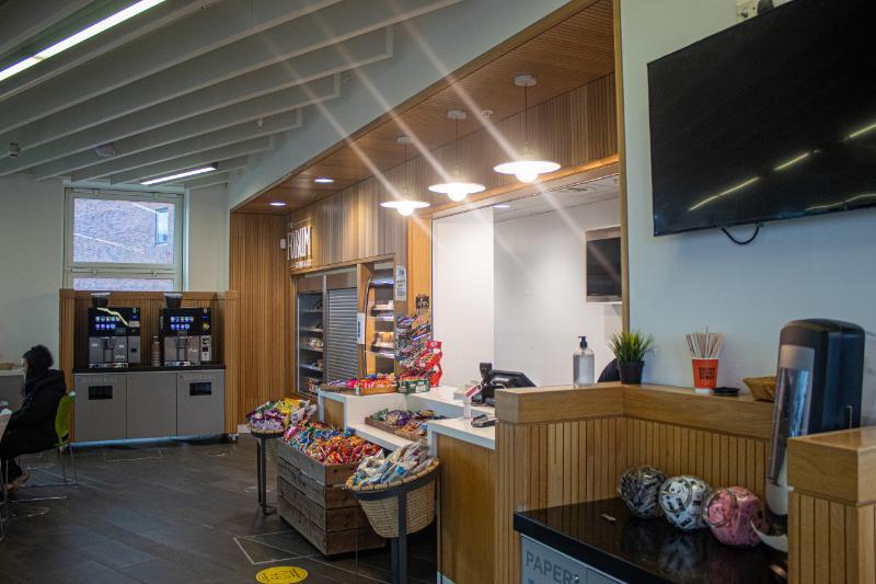 The Forum Cafe in the MU building, with seating, counters, coffee machines and snack fridges