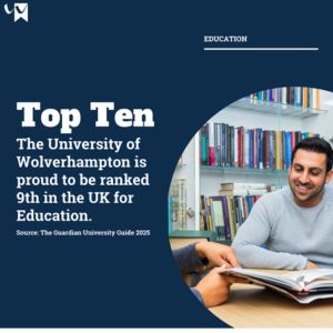 Top Ten in the UK for Education (Guardian University, 25) student sitting in library with book smiling