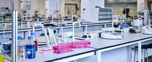 Science Lab in Rosalind Franklin Building full of equipment. Test tubes are on display on the counter top.