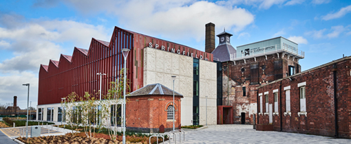 Exterior photo of the Springfield Building on a sunny day looking at the front entrance.