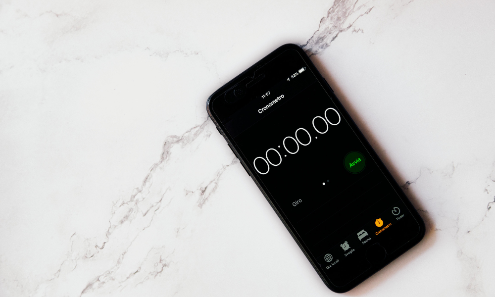 An iPhone with a timer app open laying on a countertop