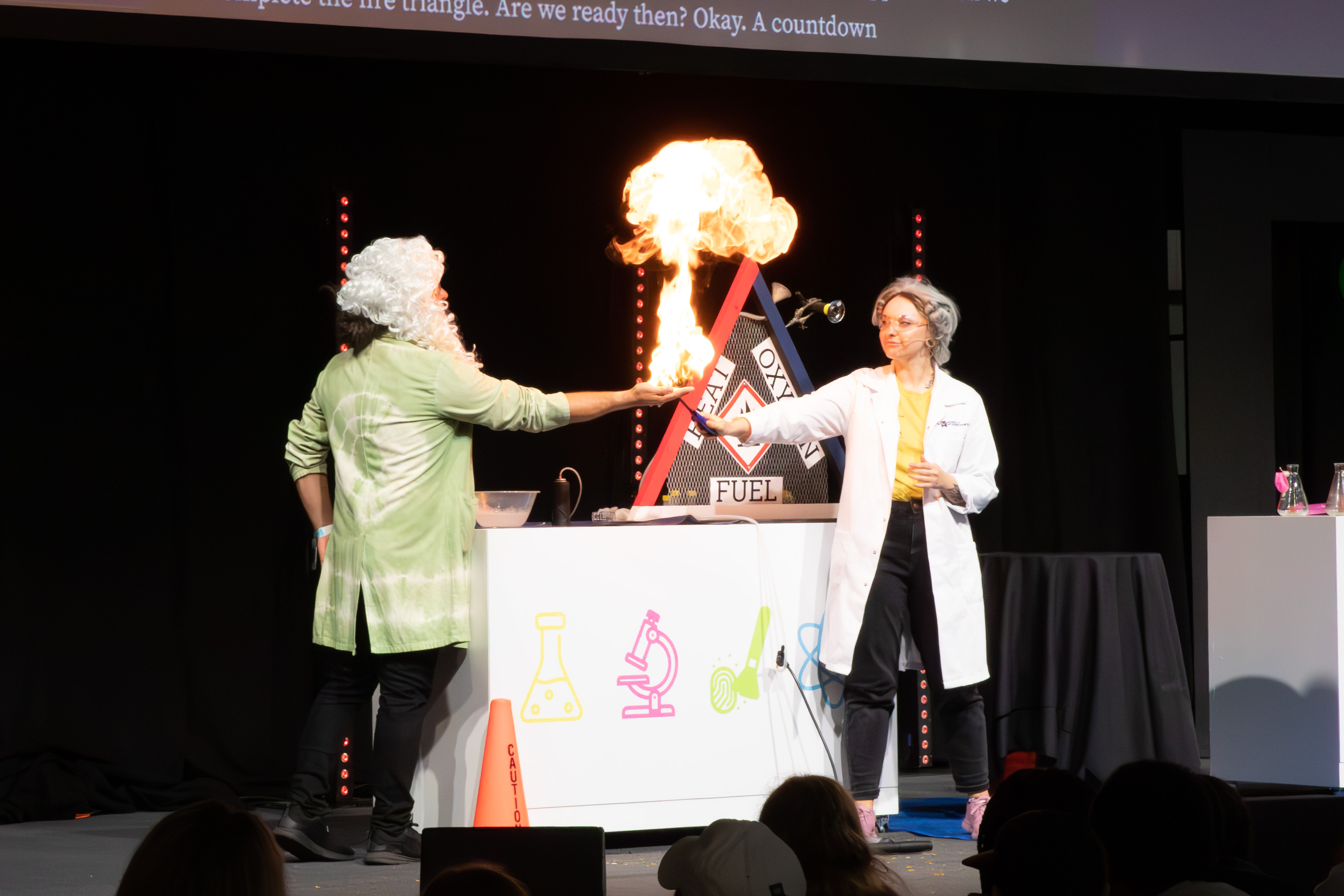 Image of Heather and Dr K creating fire on hands.