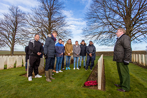Players and officials from the Corinthian Casuals lay a wreath at former goalkeeper Reginald Roger’s grave in The Somme