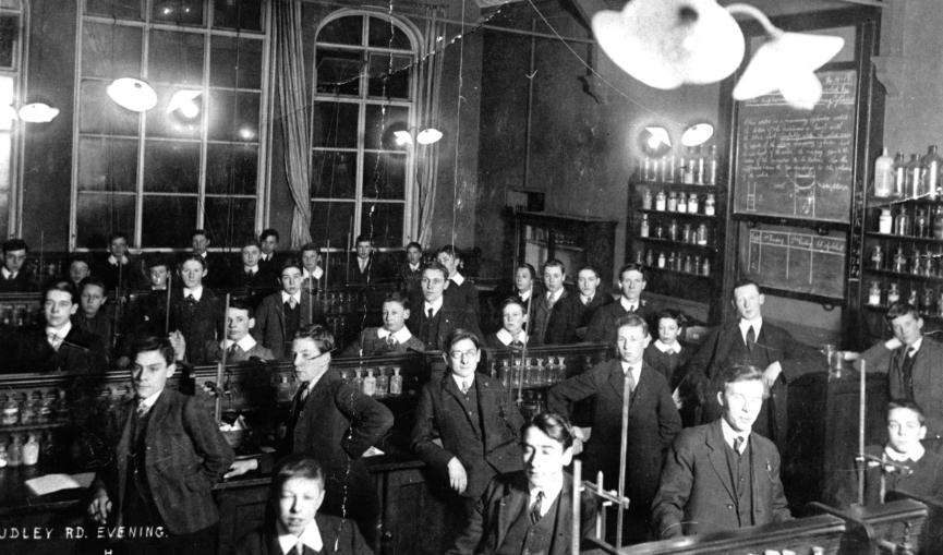 Historic black and white photograph of University of Wolverhampton students in class.