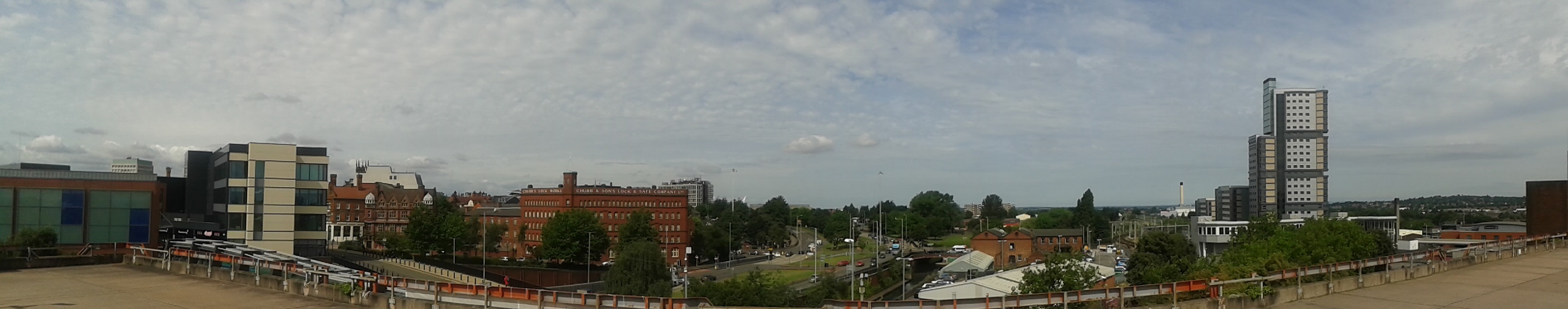 Panorama of the city of Wolverhampton taken from the car park above the train station, showing tall buildings and main roads