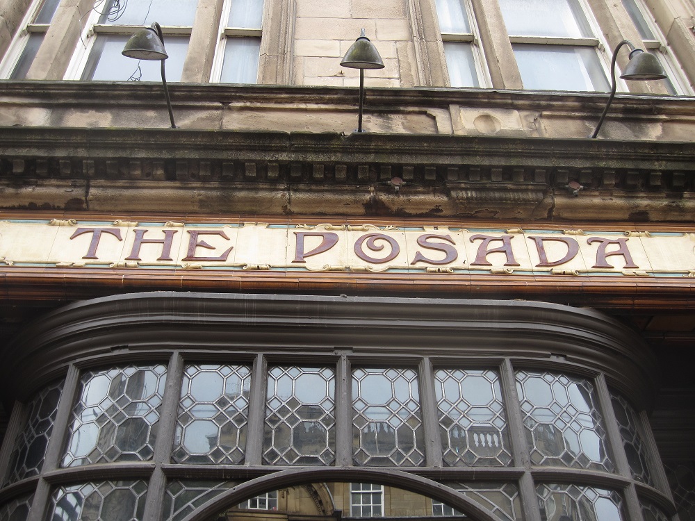 Exterior of the Posada building showing its sign, depicting its acclaimed tiling