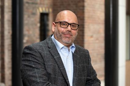 Daniel Persaud, independent governor Springfield Campus February 2024, photographed wearing a suit at Springfield campus.