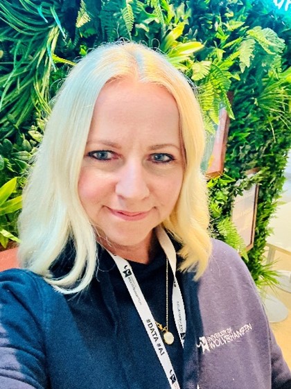 Kate Faulkner, Professional Services Governor Election Nominee 2024, wearing a University of Wolverhampton jacket and lanyard.