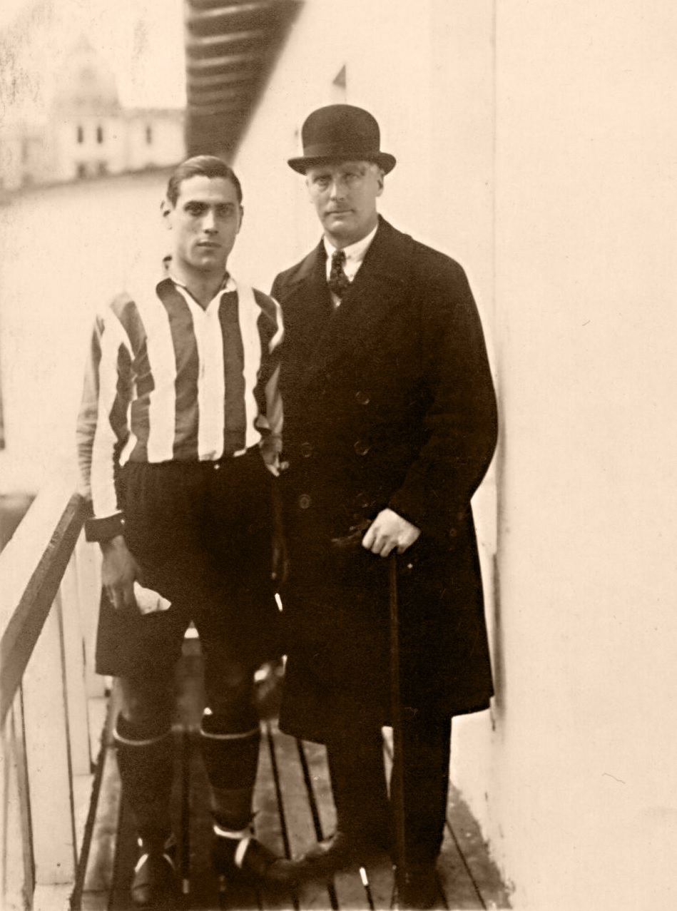 Mr Pentland standing with a football player