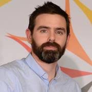 Photograph of Ian Lahart wearing a blue shirt.