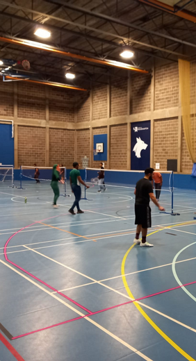 Students playing Badminton in the City Campus sports hall