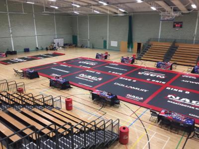 North American Grappling Association fighting mats prepared in the University sports hall, overseen by rows of seats