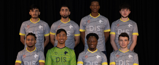 Photograph of the University of Wolverhampton men futsal team for 2023-24, posed together wearing matching grey uniforms with yellow details.