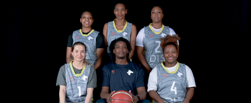 Photograph of the University of Wolverhampton women basketball team for 2023-24, posed together wearing matching grey uniforms with yellow details.