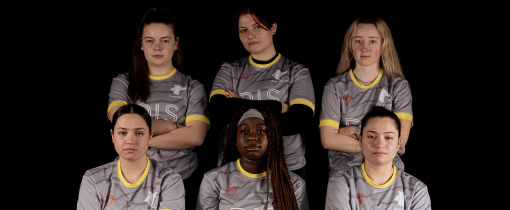 Photograph of the University of Wolverhampton women futsal team for 2023-24, posed together wearing matching grey uniforms with yellow details.