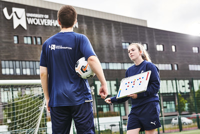 Student giving tactical information to team player