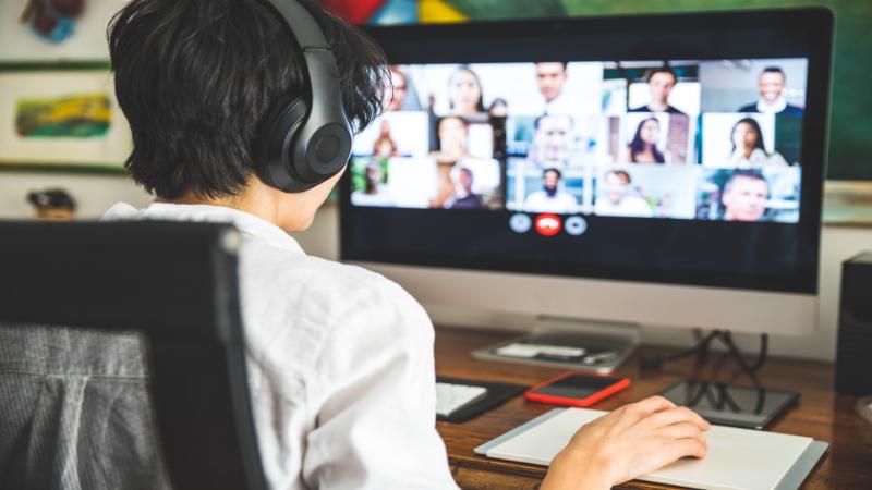 Student sitting at computer on Zoom or Teams