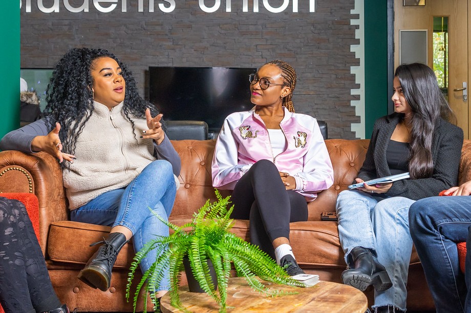 Three students chatting in the student's union