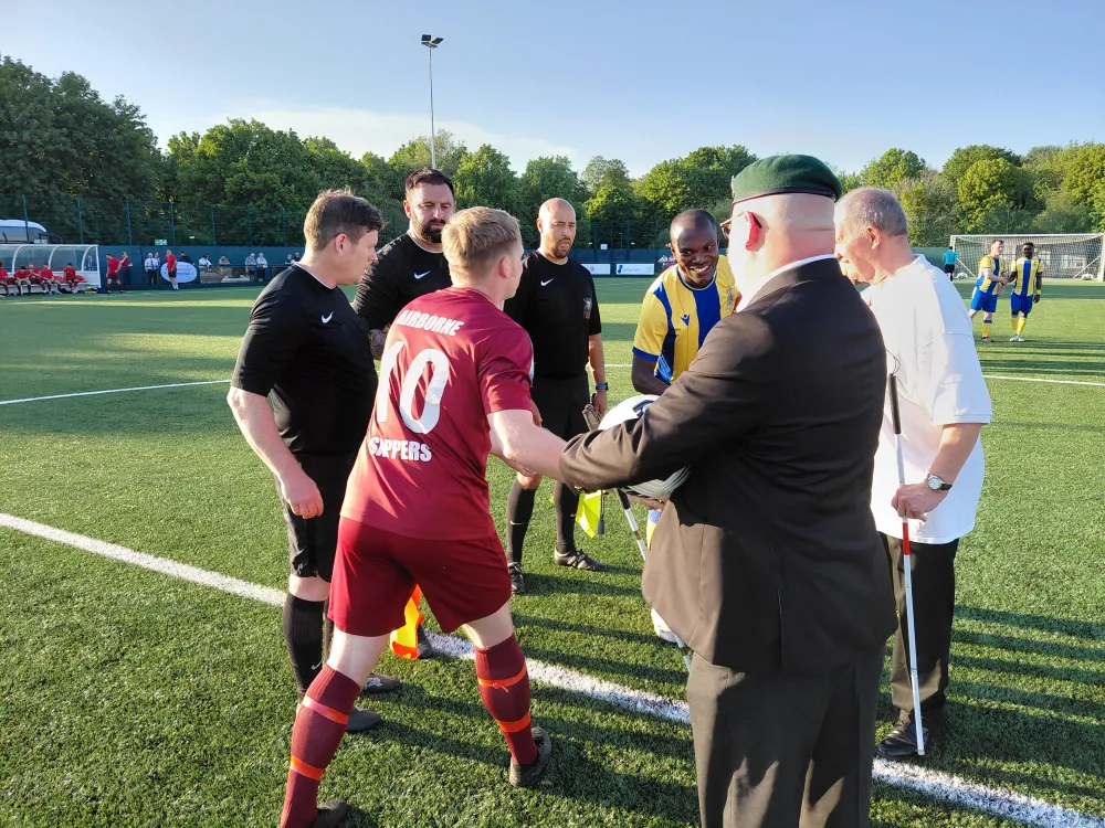 Blind Veterans UK Ambassador Chris Presenting the Match Ball