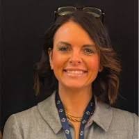 headshot of white lady with shoulder length brown hair